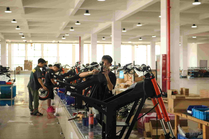 Tuttio electric dirt bikes assembled on factory assembly line for retail orders