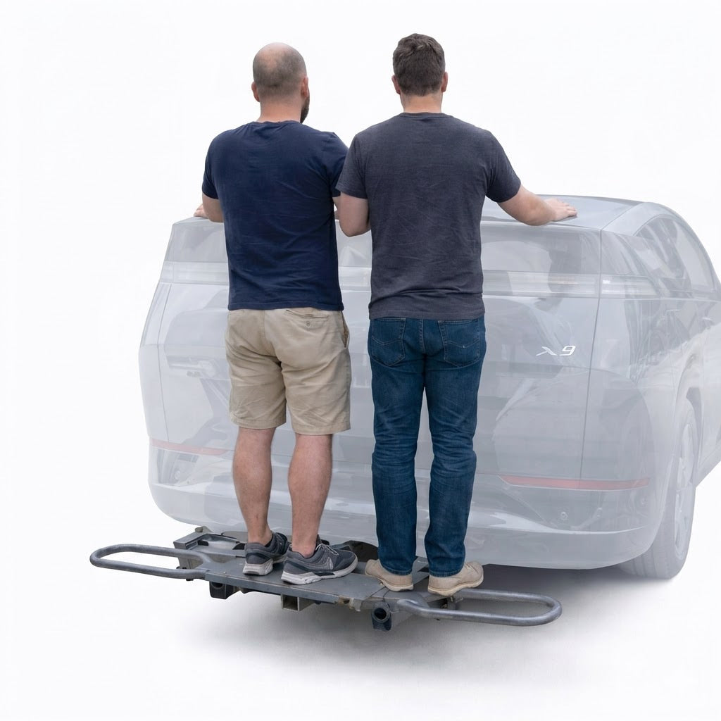 Two men standing on hitch mounted bike carrier rack demonstrating heavy duty load capacity