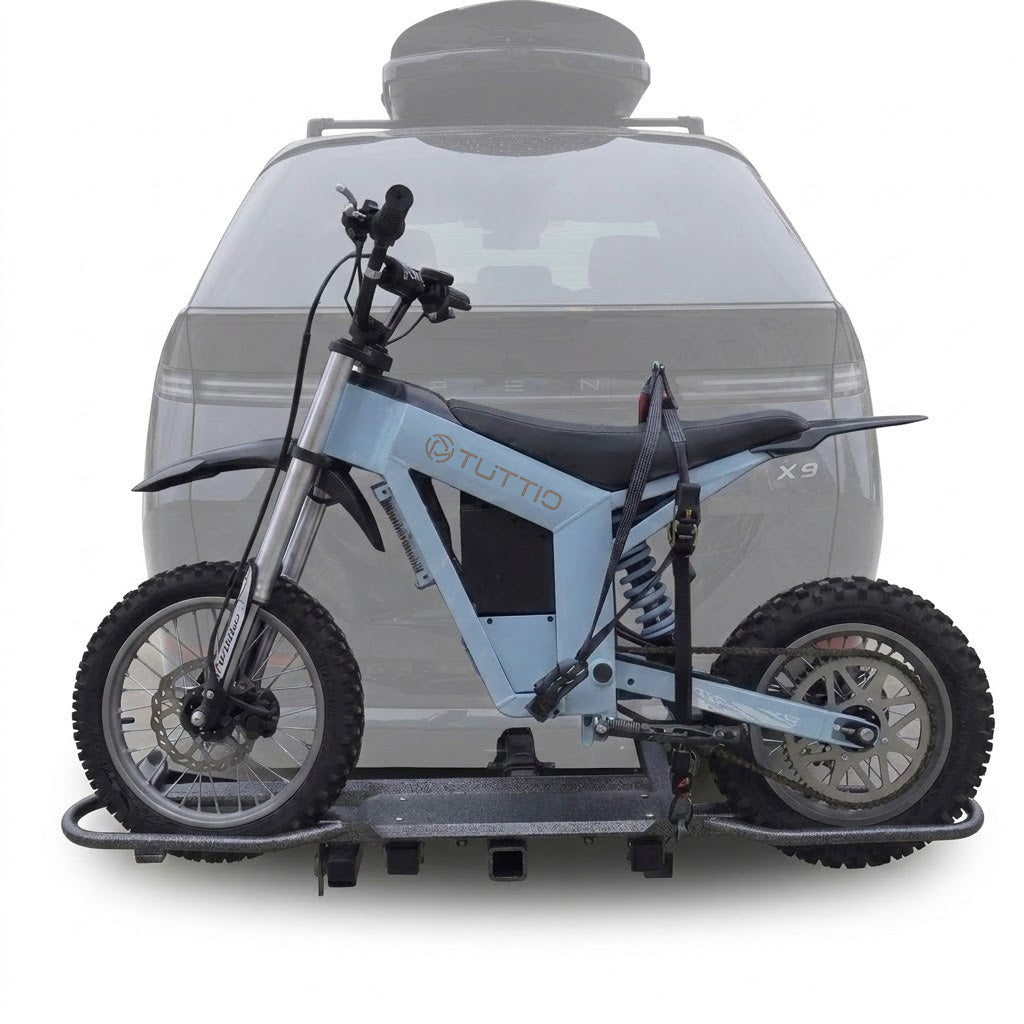 Hitch mounted e-bike carrier rack installed on the rear of an SUV for outdoor transport
