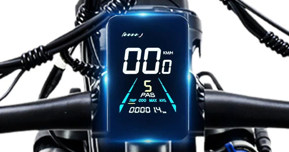 Close-up of the Tuttio Adria26 handlebar display showing speed, PAS level, mileage, and control cables around the center screen