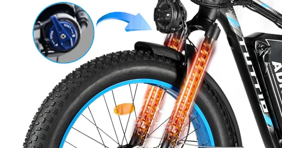 Close-up of the Tuttio Adria26 front suspension with fat tire, blue rim, front fender, fork detail, and an inset showing the suspension component