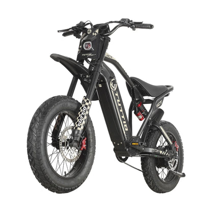 Displayed on a seamless white studio background, this front three-quarter view of the black Tuttio ICT electric dirt bike emphasizes its bold headlight design, checkerboard suspension accents, and rugged fat tires.