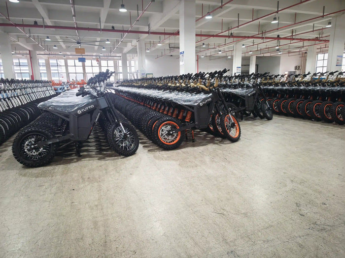 TuttioMake Soleil01 SE electric mini bikes lined up in the factory before EU warehouse shipment